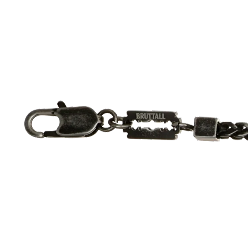 Bruttall CORE bracelet featuring a dark chain structure and faceted black Swarovski crystals for a bold look.