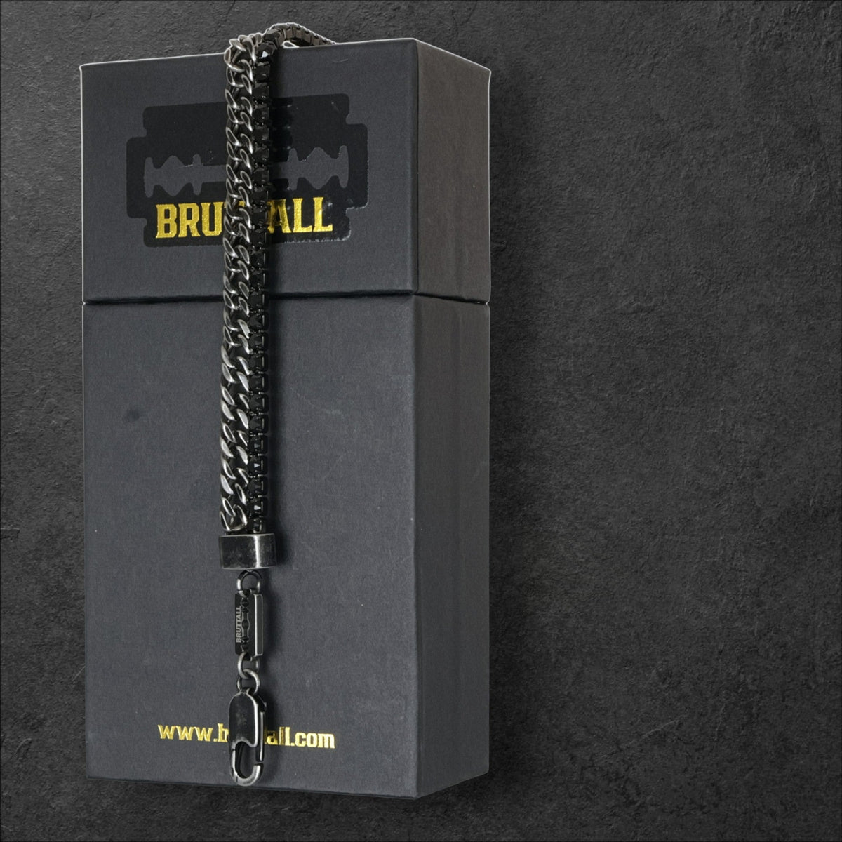 Bruttall GATE bracelet in antique black with Swarovski crystals and a chain link design on a branded gift box