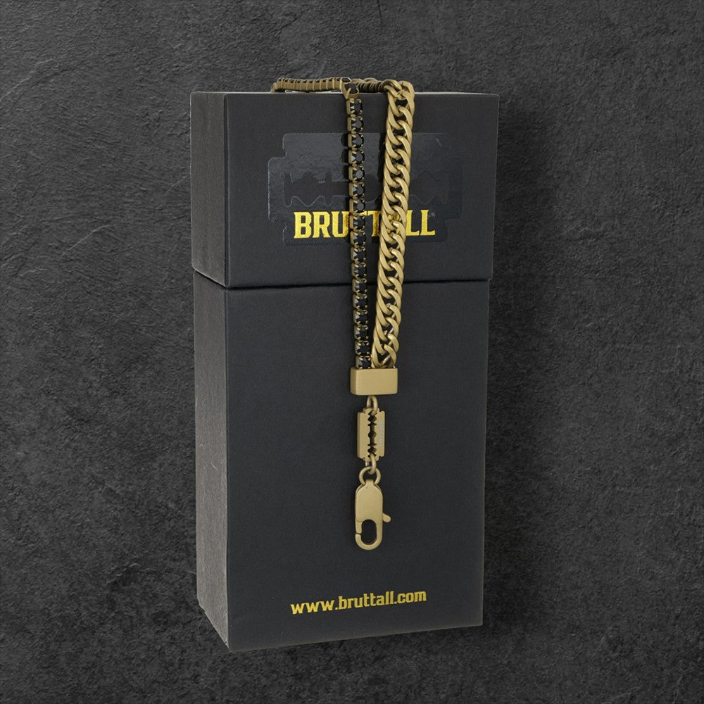 Bruttall GATE necklace featuring a matte gold Cuban chain, black Swarovski crystals, and a razor blade pendant.