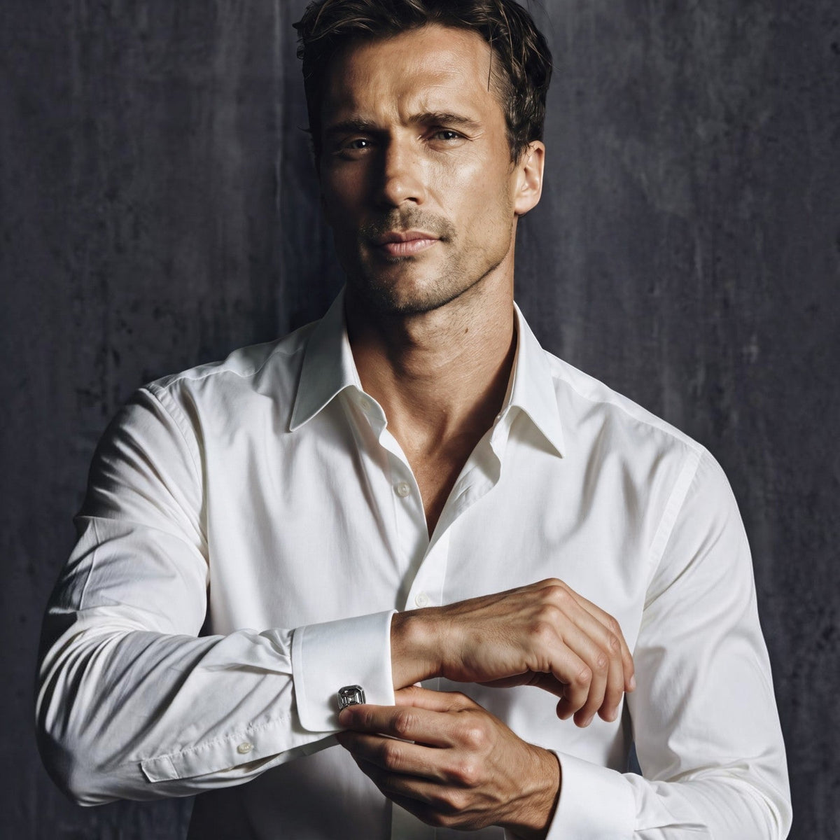 Man wearing a white shirt with Bruttall OCTANT antique black cuff links featuring Swarovski crystals