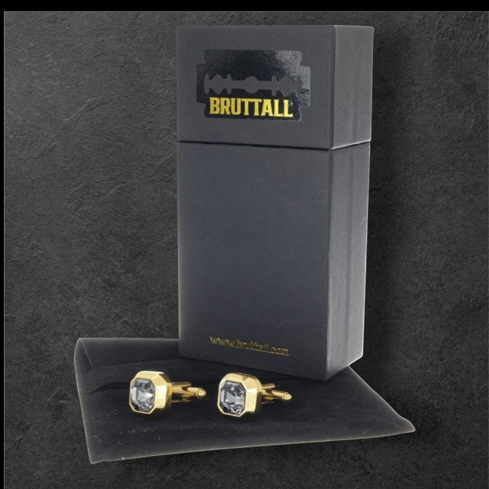 Bruttall OCTANT cufflinks in matte gold with Swarovski crystals displayed with their black branded gift box