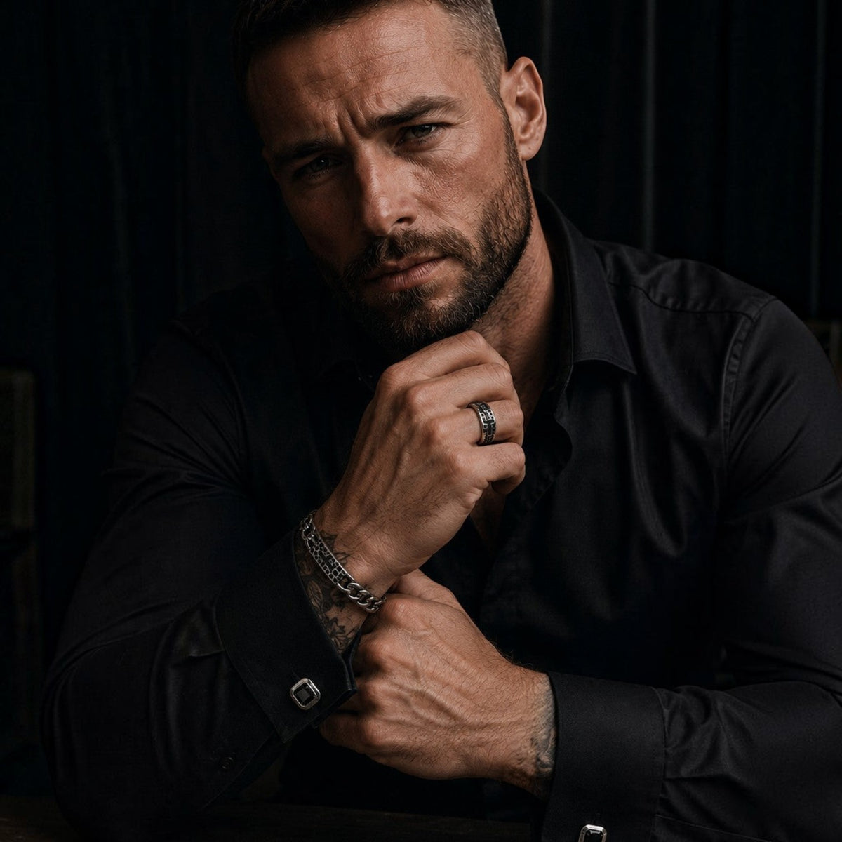 Bruttall RAW cross bracelet with Swarovski Zirconia and antique plating worn by a man in a black shirt