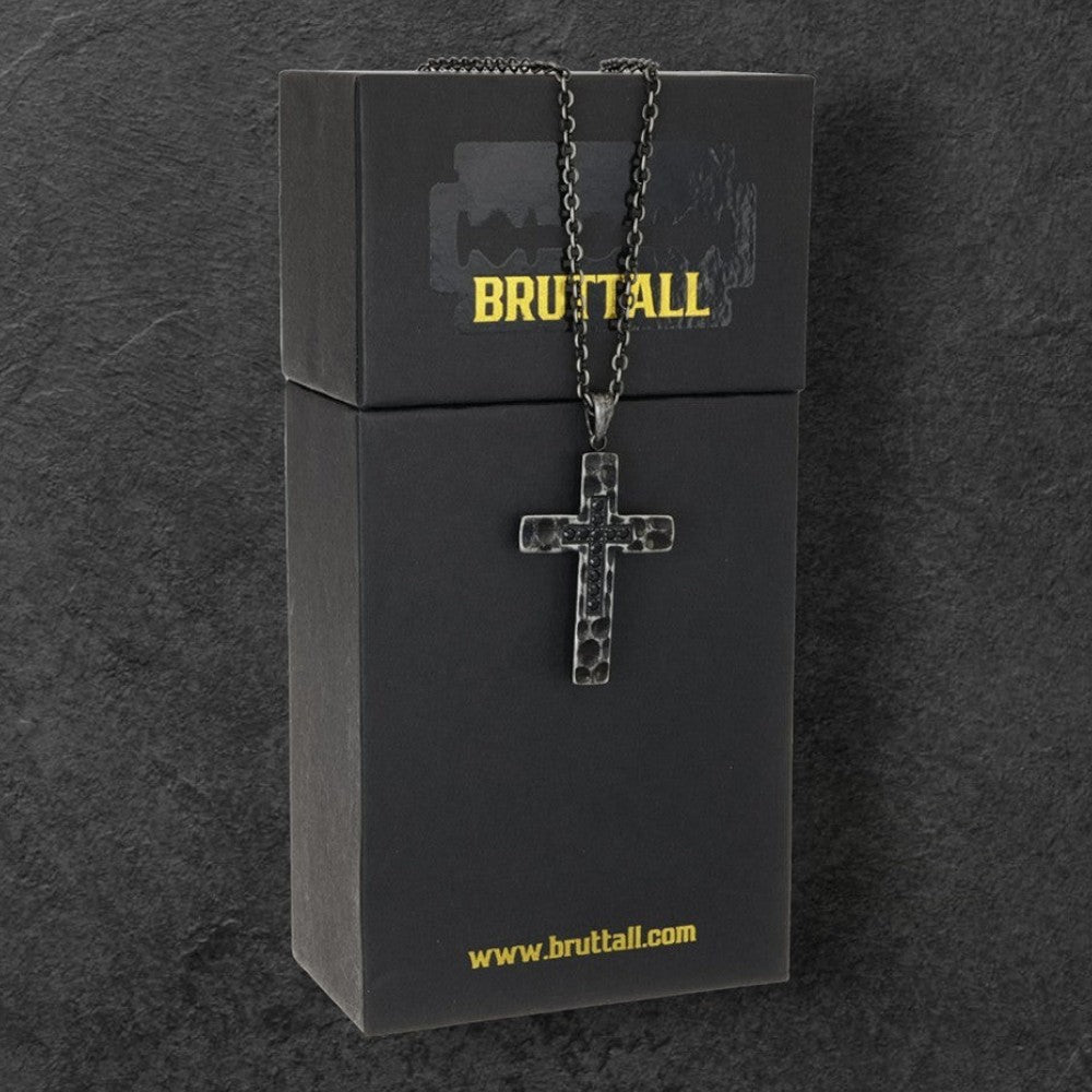 Bruttall RAW cross pendant necklace with antique plated hammered texture and black Swarovski Zirconia on black box