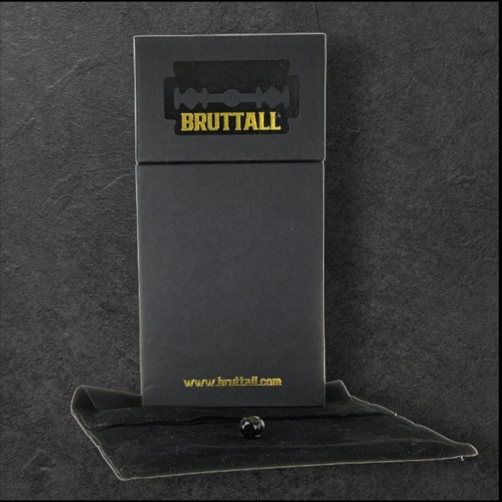 Bruttall RAZOR magnet earring with Swarovski Zirconia in antique plating displayed on a black branded gift box
