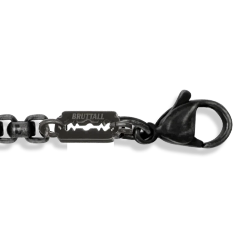 Bruttall TOWER cross bracelet in antique plated finish with a detailed razor blade charm and lobster clasp closure.