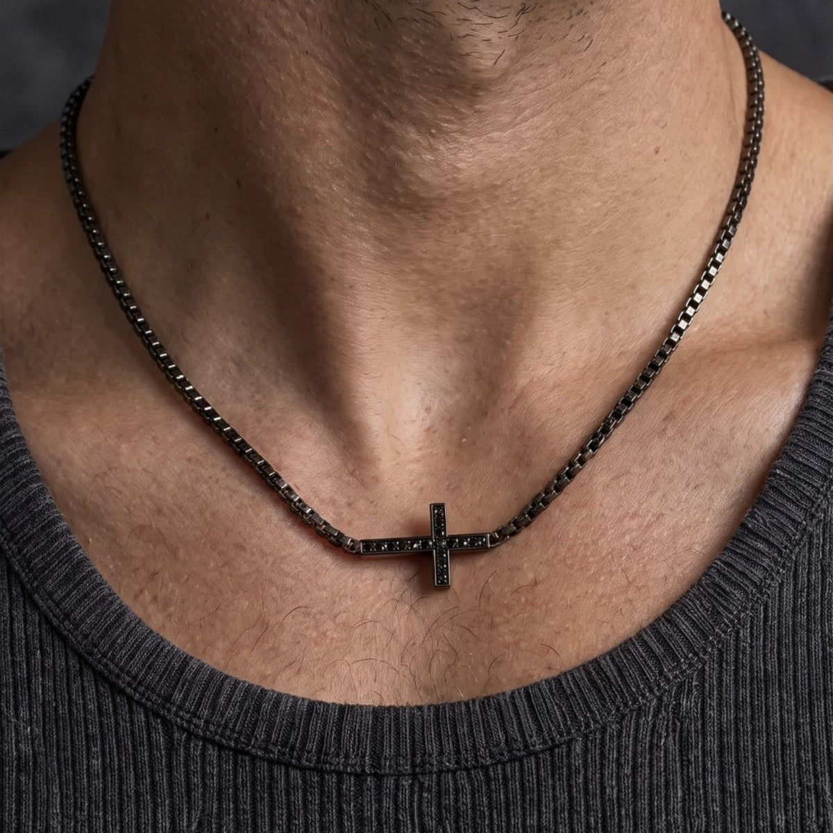 Bruttall TOWER cross necklace in antique black with Swarovski Zirconia stones worn by a man
