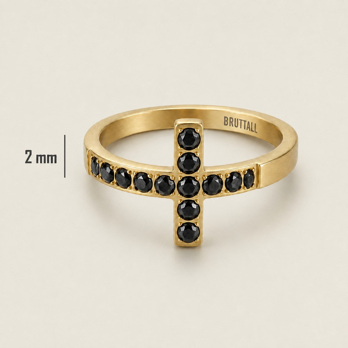 Bruttall TOWER cross ring in matte gold featuring black Swarovski crystals in a bold, architectural design.