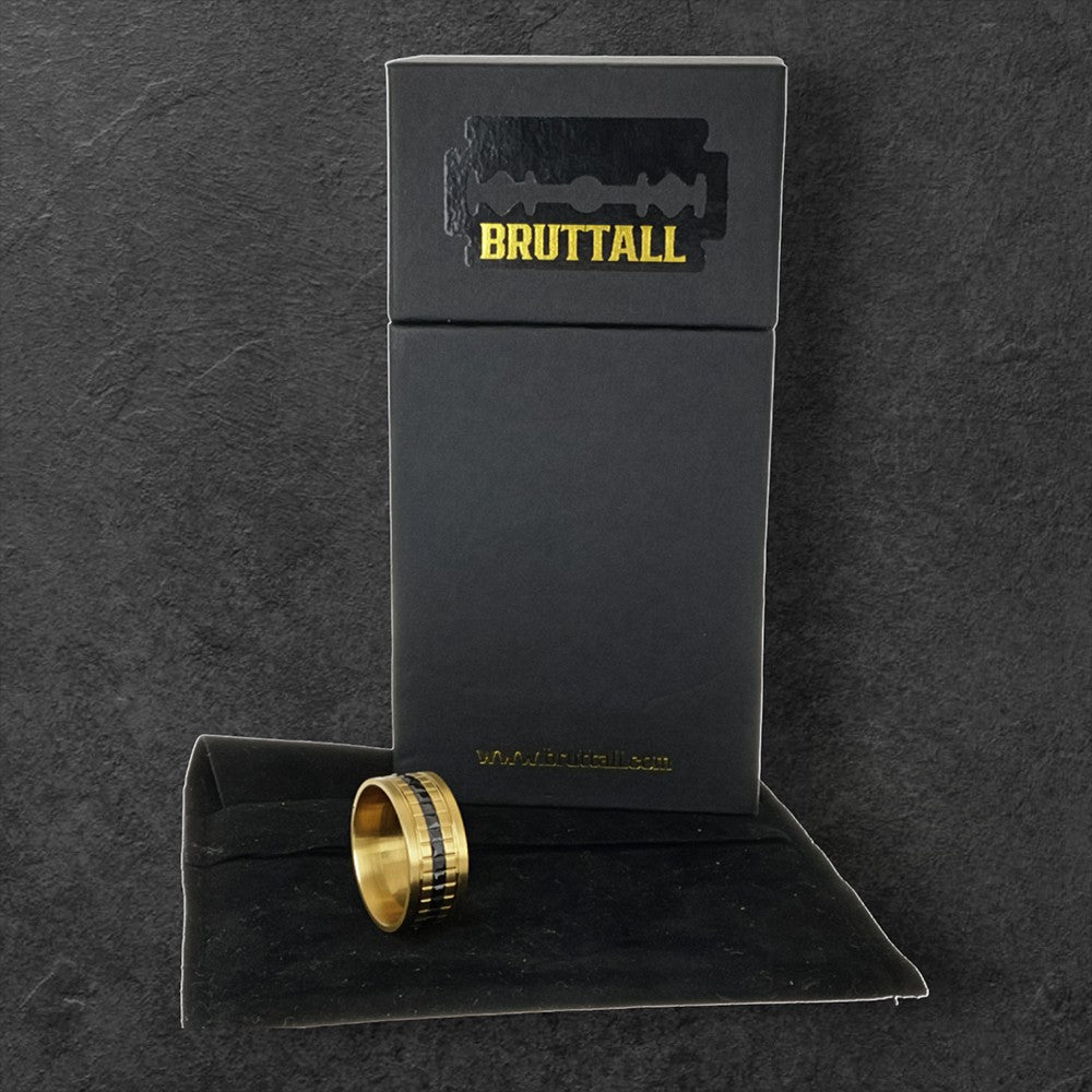 Bruttall GATE ring in matte gold featuring a central band of black Swarovski crystals with a structural design.