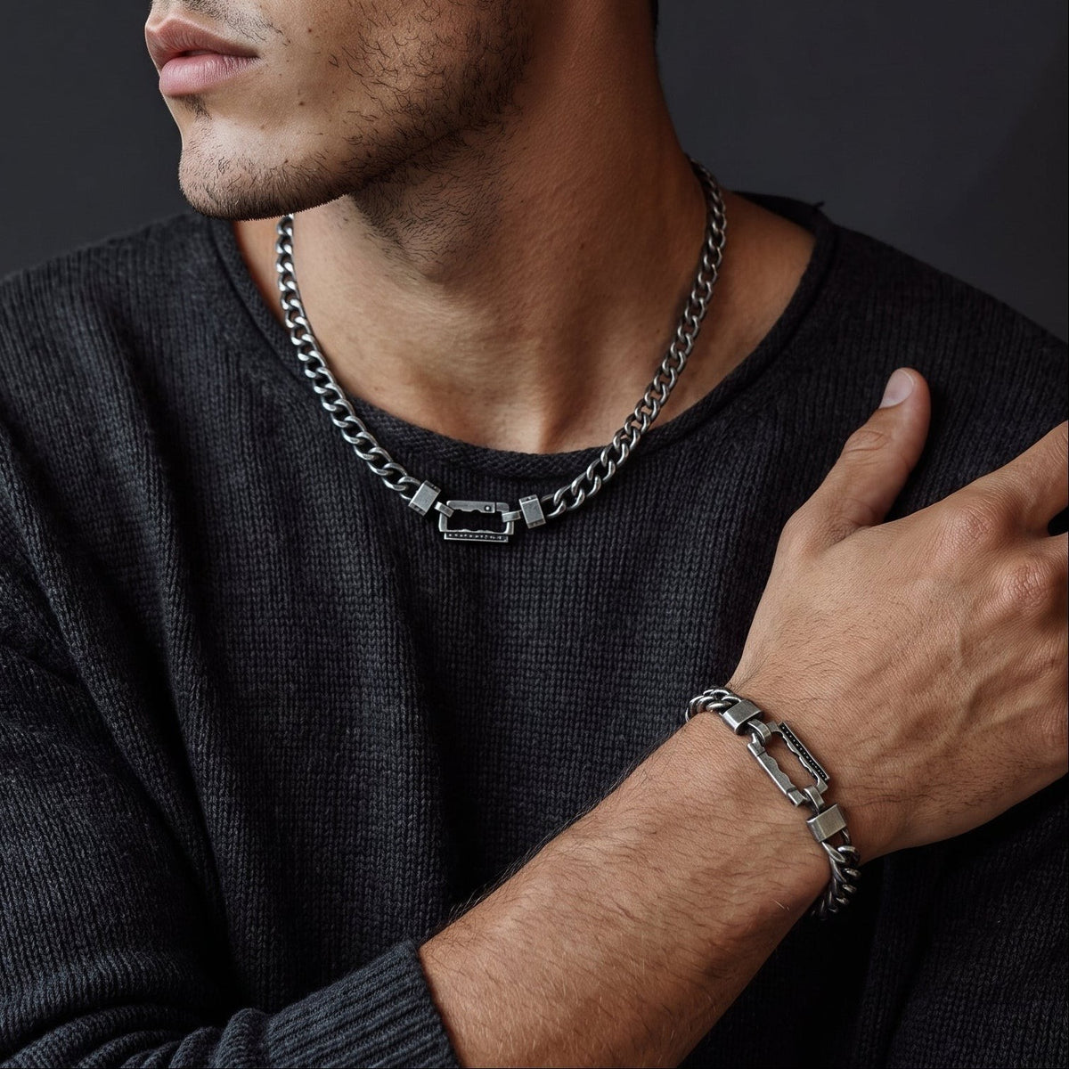 Bruttall AXIS antique black chain bracelet with Swarovski Zirconia on a man wearing a matching necklace