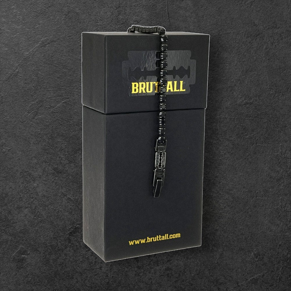 Bruttall gothic style black crystal bracelet with razor blade charm displayed on a branded black gift box